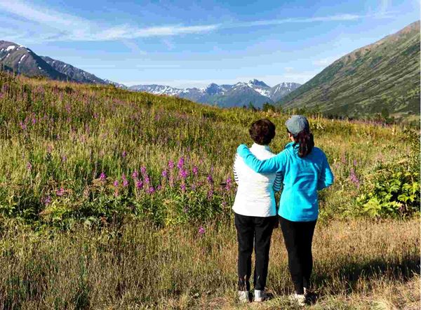 Mission Lifeline Alaska women looking at a meadow