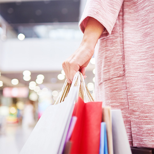 woman's hand with shopping bags