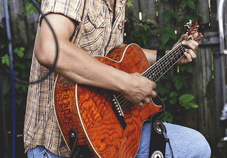 Kern County contact man playing guitar