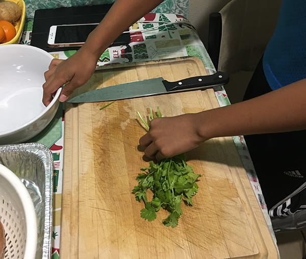Maui child cooking at home