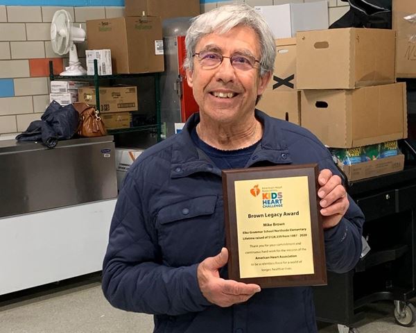 Elko Teacher Honored with Kids Heart Challenge Legacy Award Mike Brown holding plaque