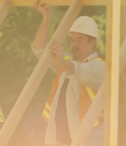 construction worker lifting a frame