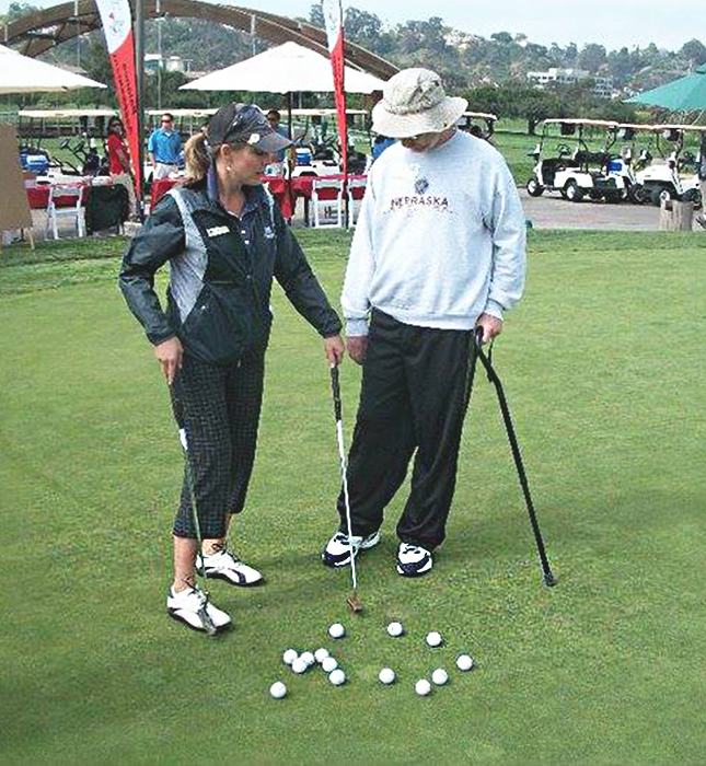 Saving Strokes 2 woman giving man golf tips