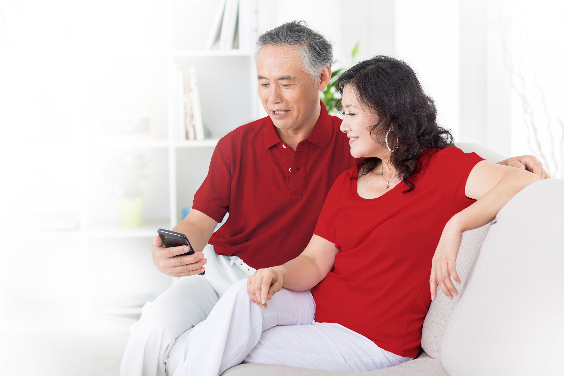 couple on couch in red