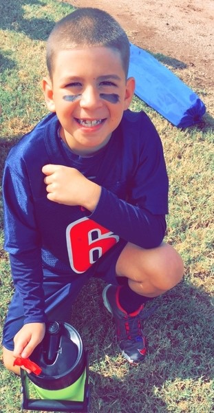 child posing with water bottle