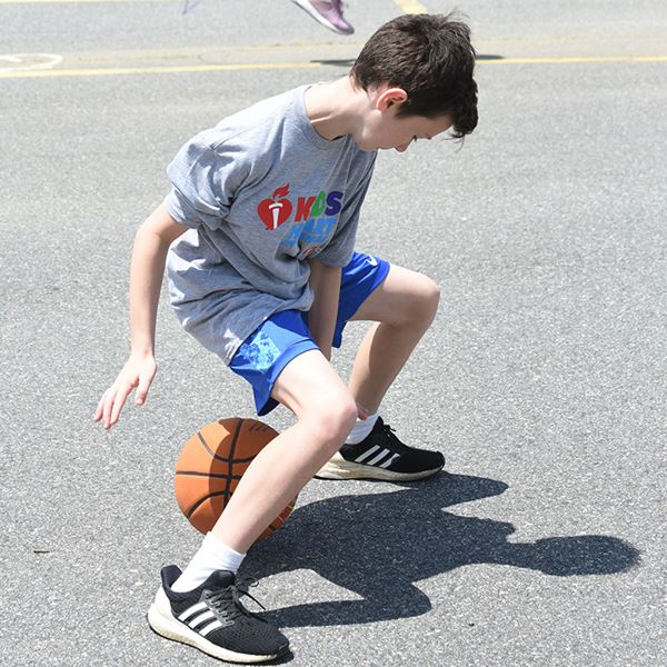 boy plays in Hoops for Heart boy plays in Hoops for Heart