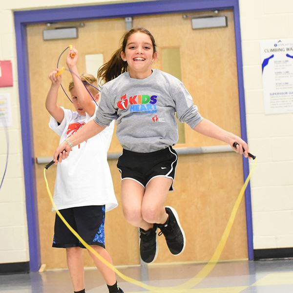 girl jumping rope in gymnasium girl jumping rope in gymnasium