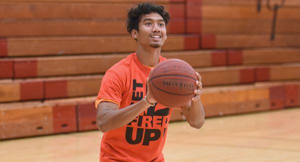 high school student shooting basketball high school student shooting basketball