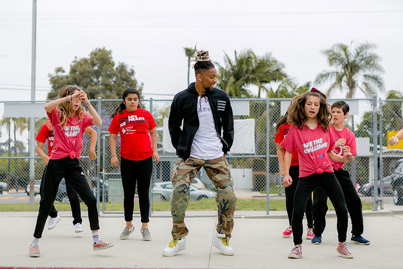 kids dancing on playground with instructor kids dancing on playground with instructor