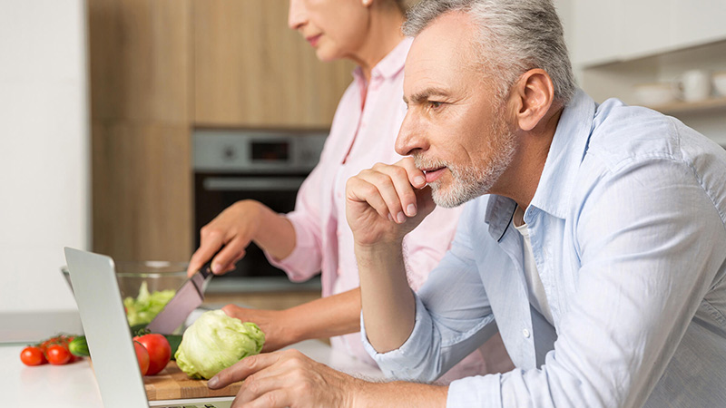 man looking at laptop