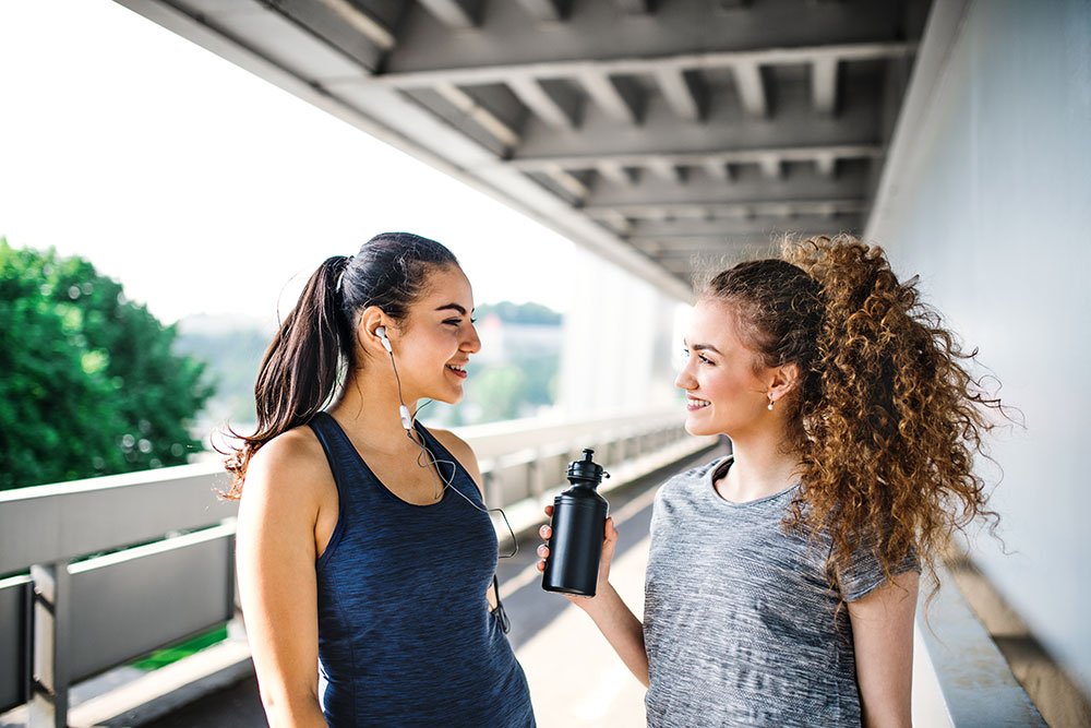 two active young women smiling