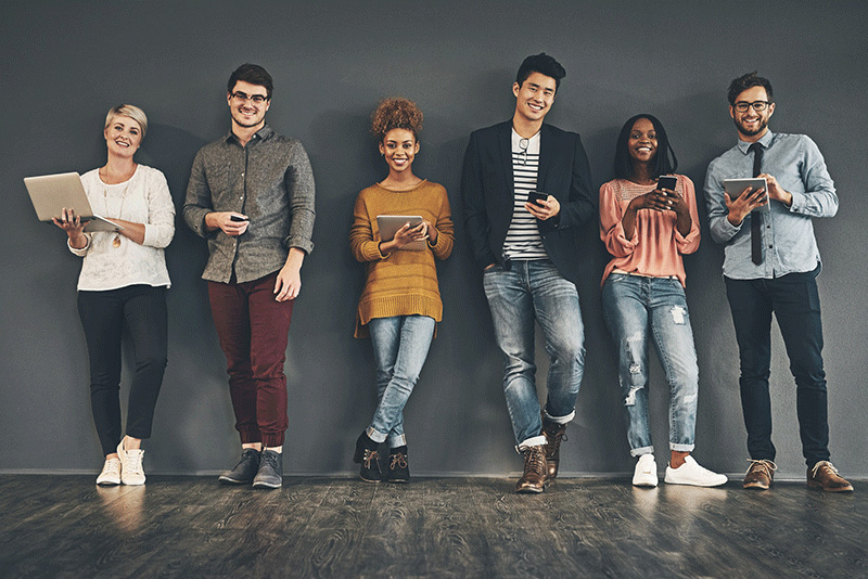 multiracial Millennials using laptops, tablets and phones multiracial Millennials using laptops, tablets and phones