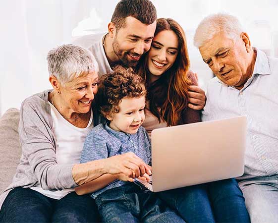family looking at a laptop computer together