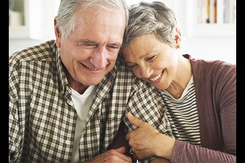 man and woman hugging