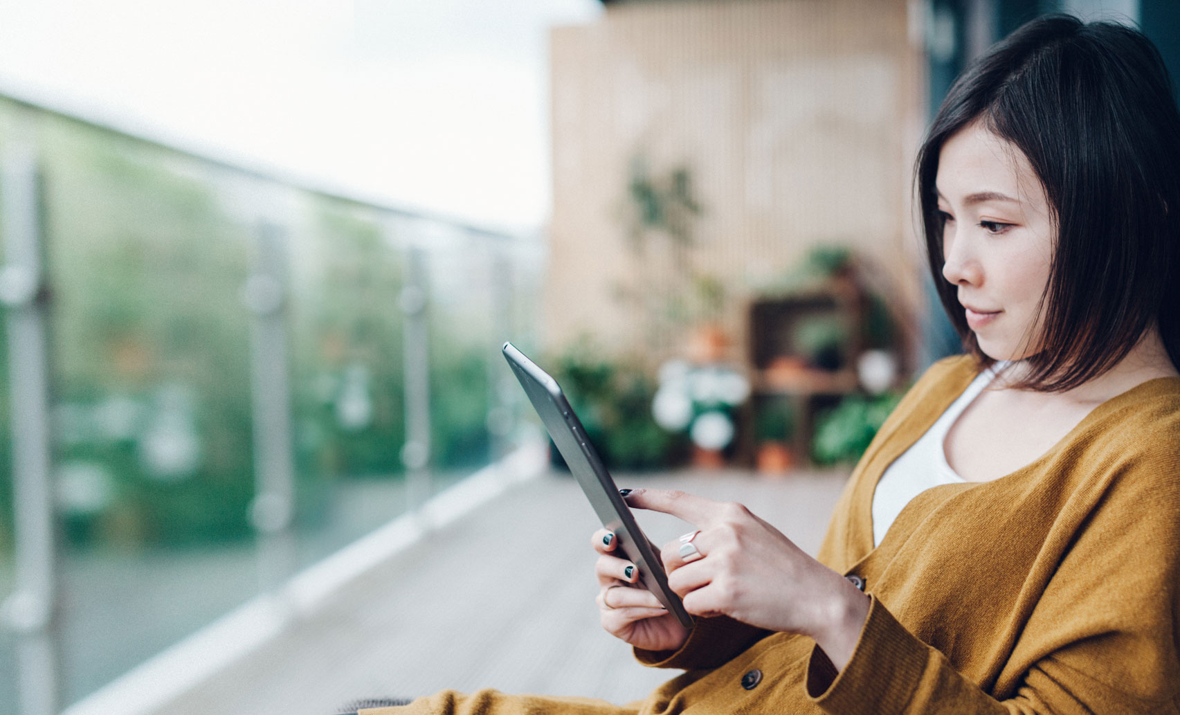 Woman reading tablet device