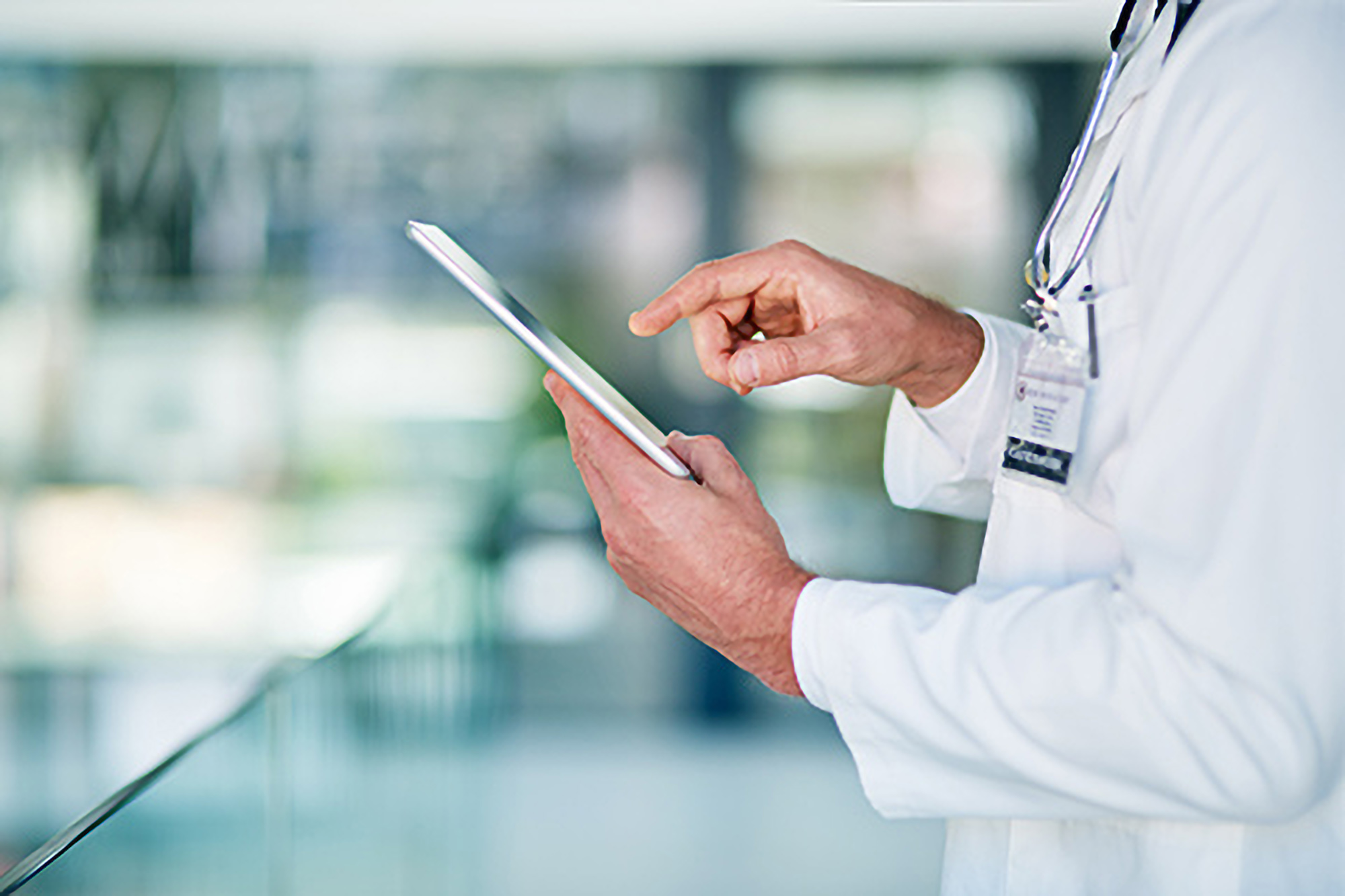 doctor viewing information on mobile device