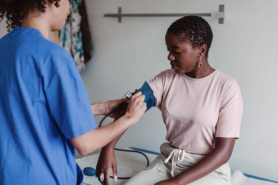 Nurse taking a patient's blood pressure