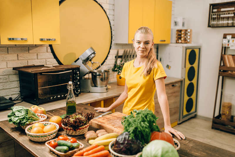 Young woman cooking in the kitchen