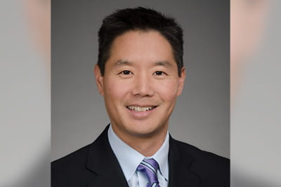 A professional headshot of Eugene Yang, MD, MS, FACC