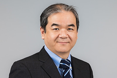 A professional headshot of Katsuhide Maeda, MD, PhD