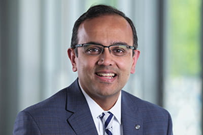 A professional headshot of Manesh Patel, MD, FAHA