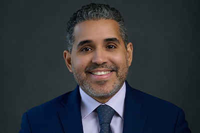 Professional headshot of Dr. Billy A. Caceres (copyright Ismael Fernandez)