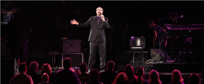 Bobby Z. speaks to the crowd during the