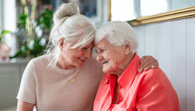 Two women smiling together