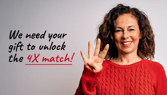 Woman holding up four fingers