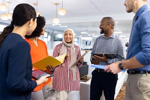 stock photo of coworkers meeting in an office environment