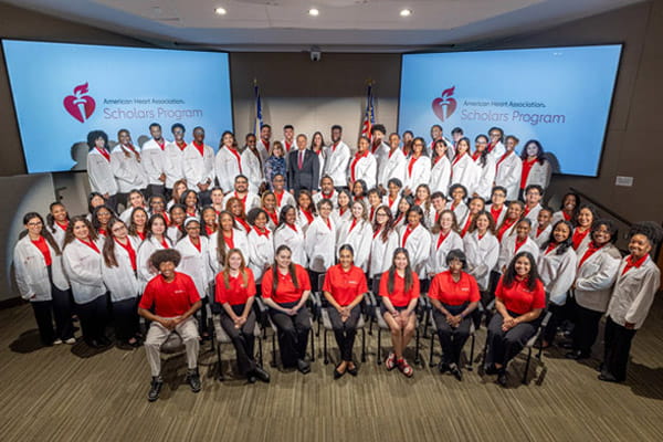 Tiered group photo of American Heart Association Scholars at the program's symposium