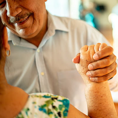 Close-up of a senior couple dancing at a dance studio