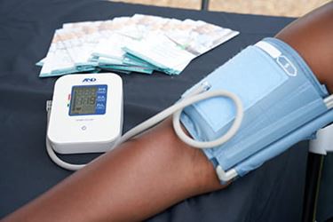 Person measuring blood pressure