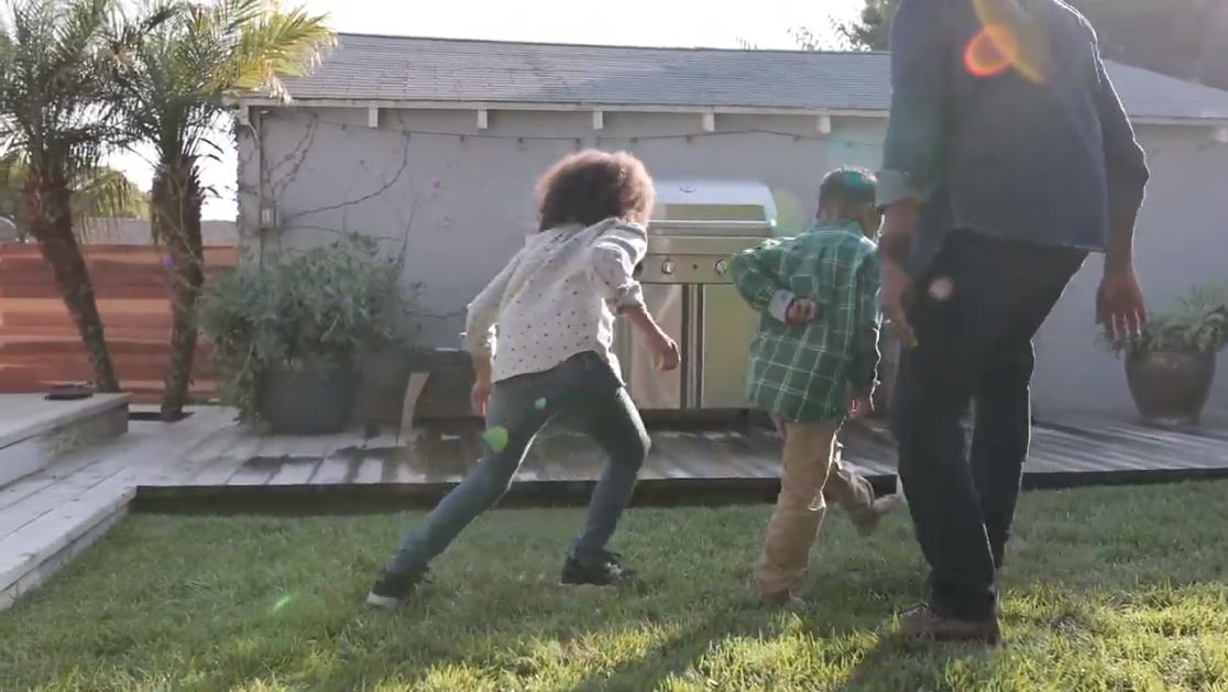 family playing soccer