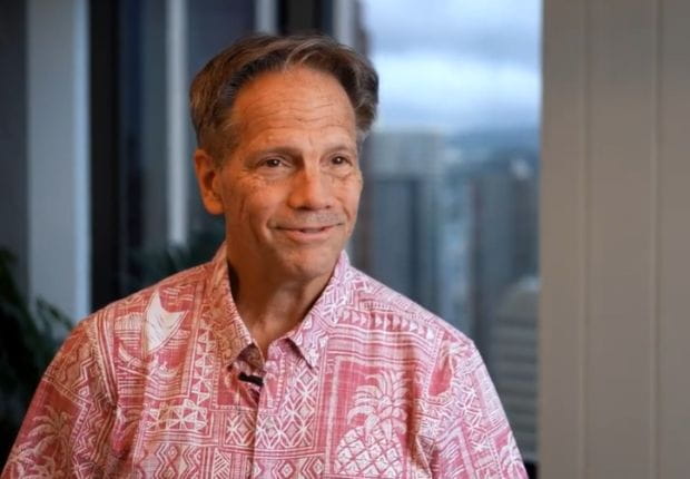 Brandt Farias smiling in a red and white Hawaiian shirt