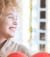 Boy smiling with heart