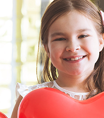 Girl smiling with heart