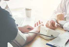 person checking blood pressure
