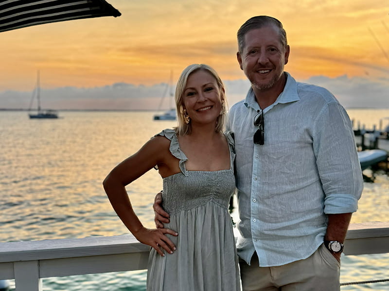 Kyle Hartley and Alex Stolle viewing the sunset near the water in Abaco, Bahamas