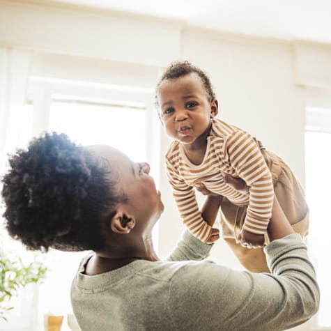Black mother holding baby