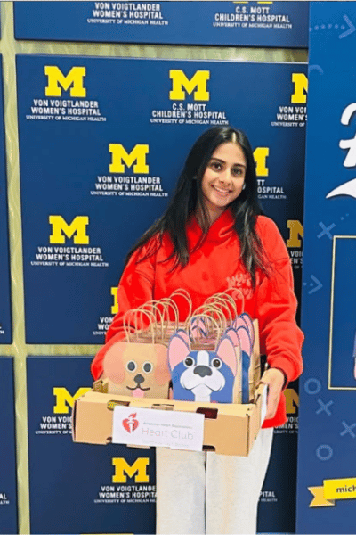Student delivering art kits to a Hospital