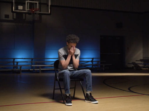 Dra sitting in gymnasium Dra sitting in gymnasium