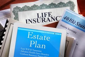 Downward view looking at a pile of estate planning documents and folders